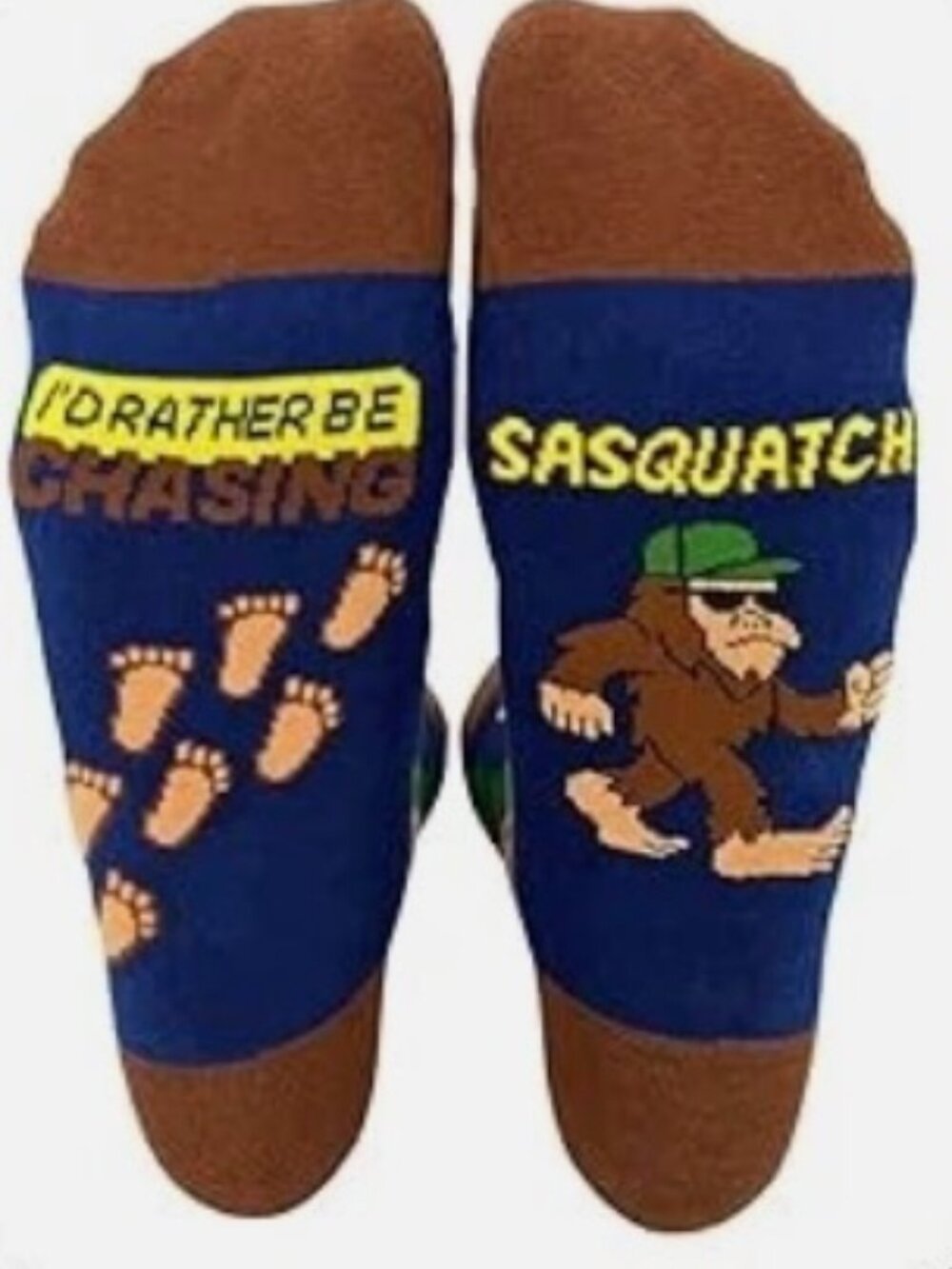 Socks Colorful Sasquatch and woodland design in navy, brown, and green.